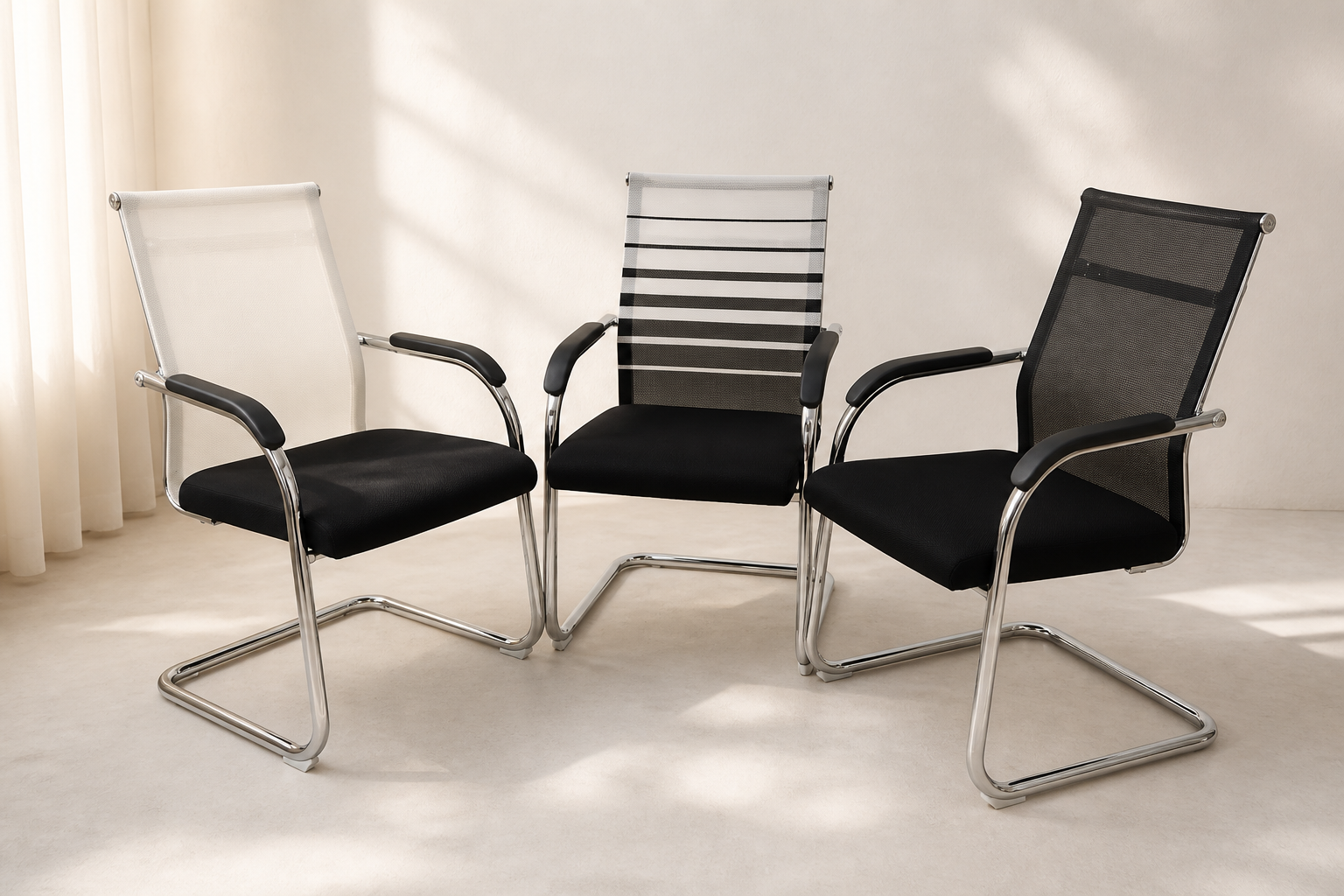 Three chrome cantilever visitor chairs with mesh backs