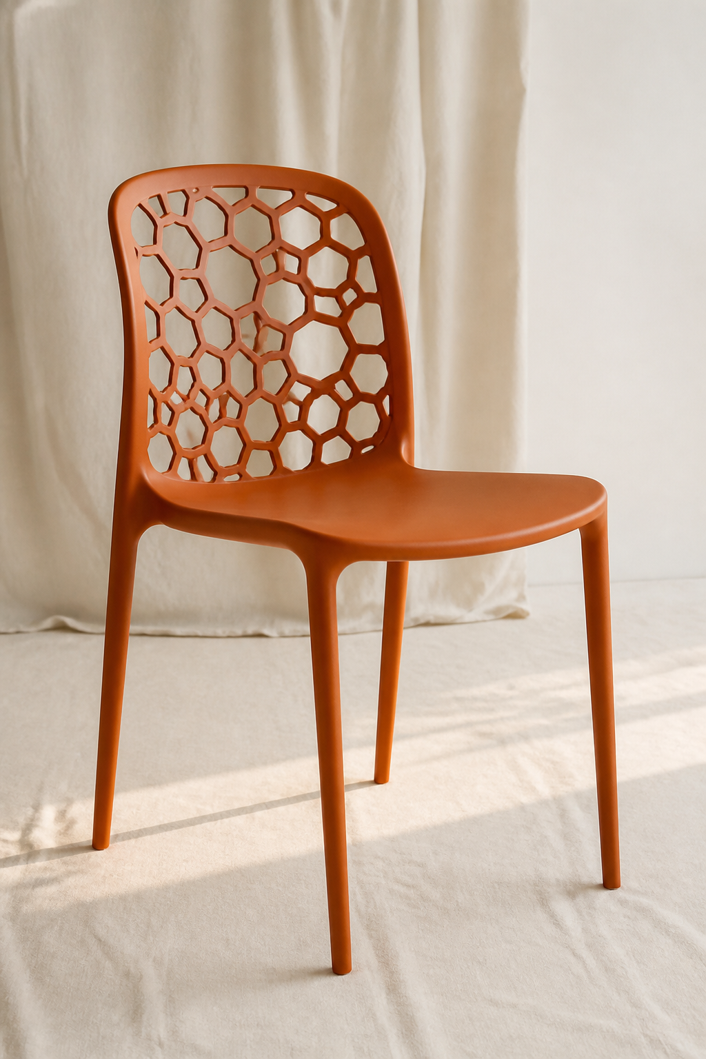 Orange molded plastic cafe chair